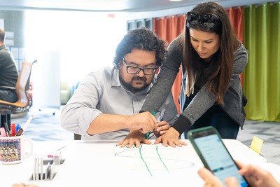 teacher aiding student with a in class assignment